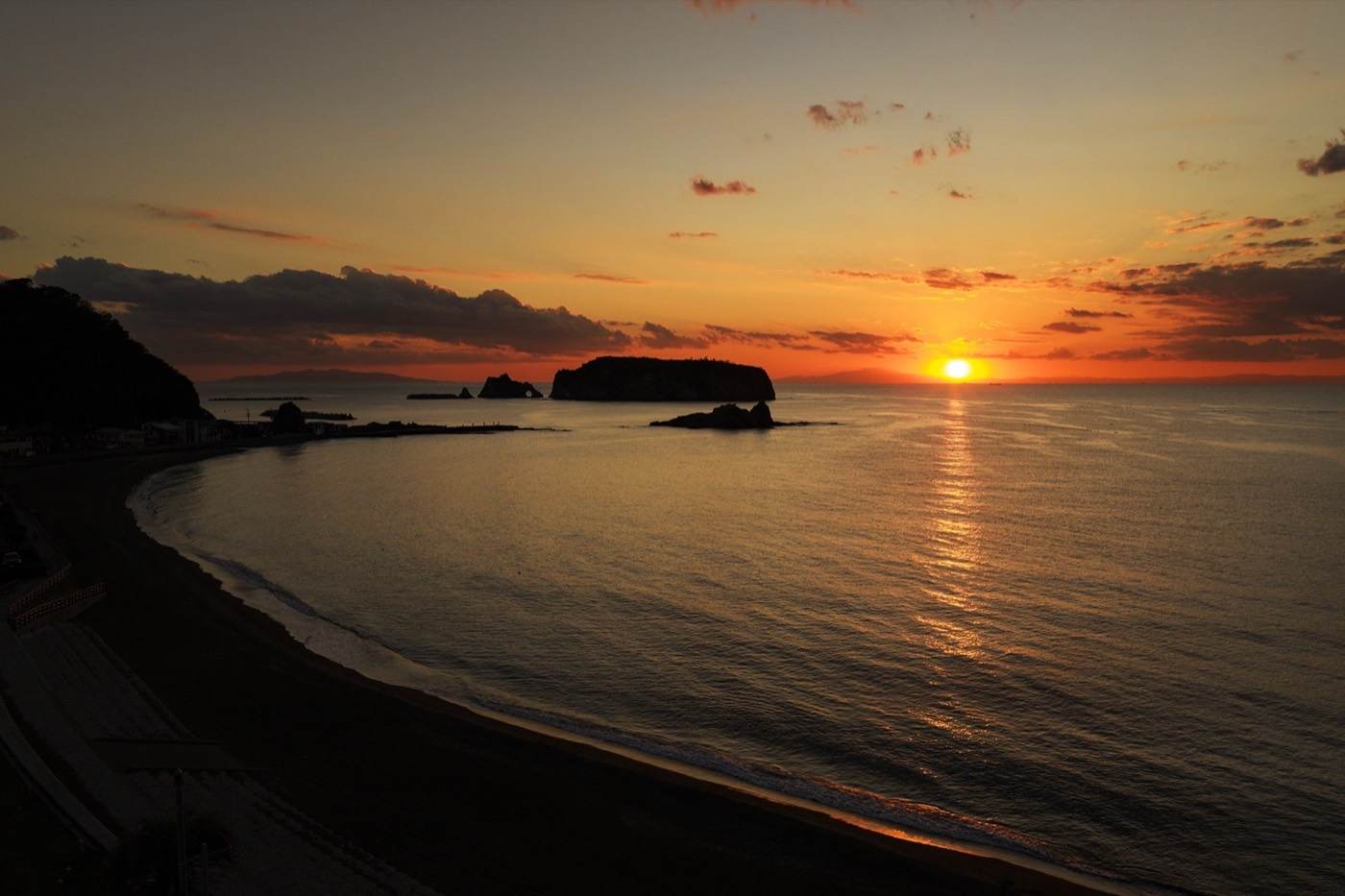 A Kyonan beach at sunset with an island offshore